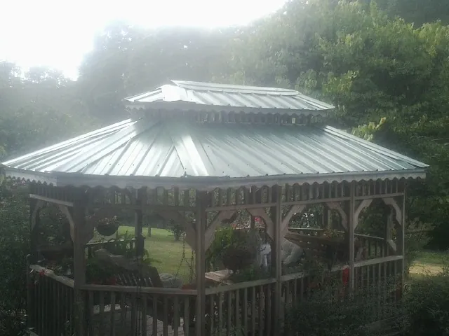 Two tier green metal roof on a garden gazebo in Wassaic